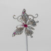 Broche en plata con perlas de agua dulce, marcasitas y rubíes.